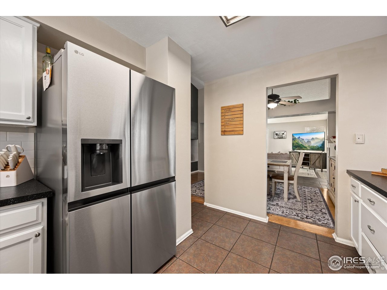 7328 South Gore Range Road Littleton, CO 80127 - Photo 12 of 38 a kitchen with stainless steel appliances granite countertop a refrigerator and a sink