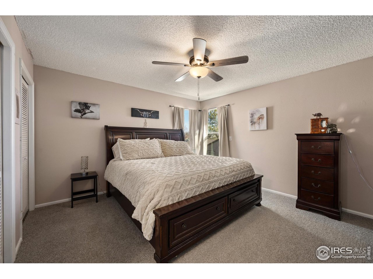 7328 South Gore Range Road Littleton, CO 80127 - Photo 14 of 38 a bedroom with a bed dresser and a window