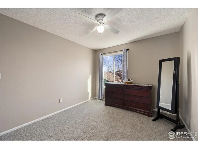 a bed room with a bed and a window