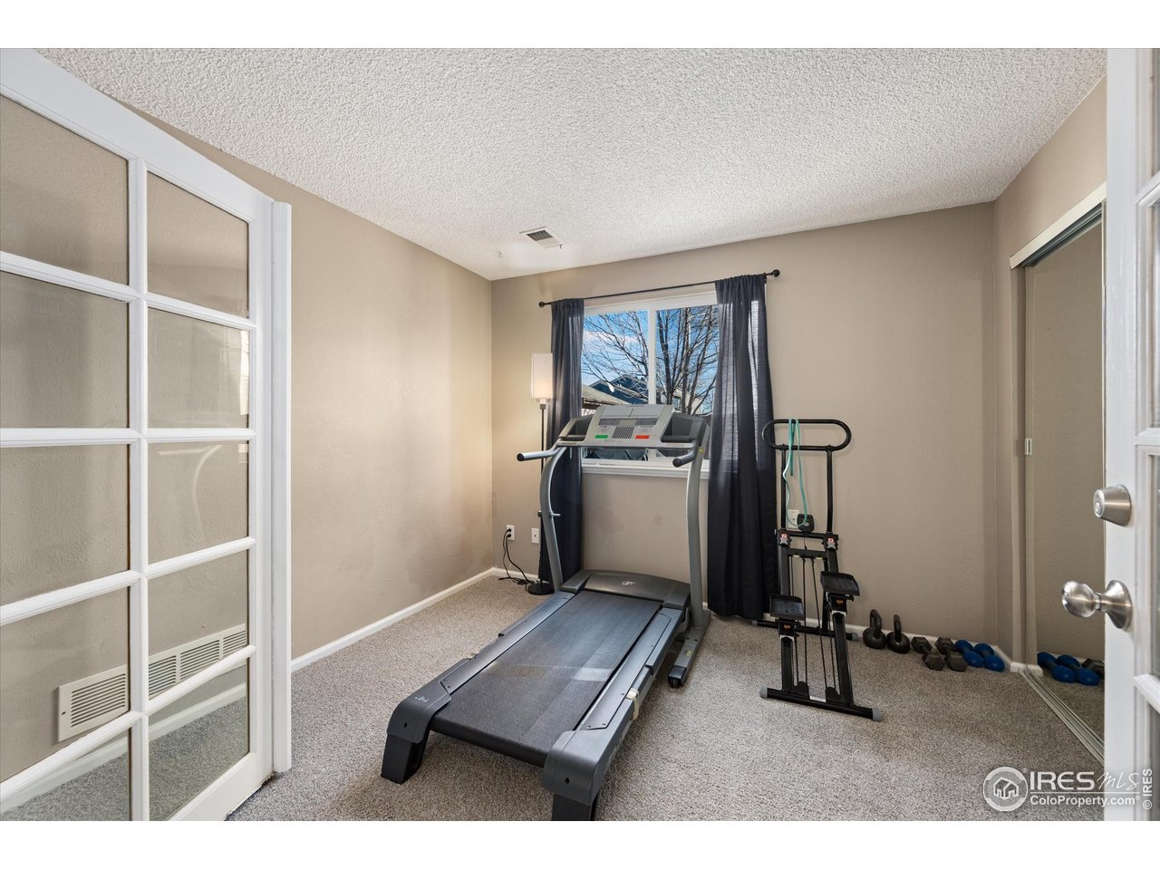 7328 South Gore Range Road Littleton, CO 80127 - Photo 20 of 38 a room with furniture mirror and a window