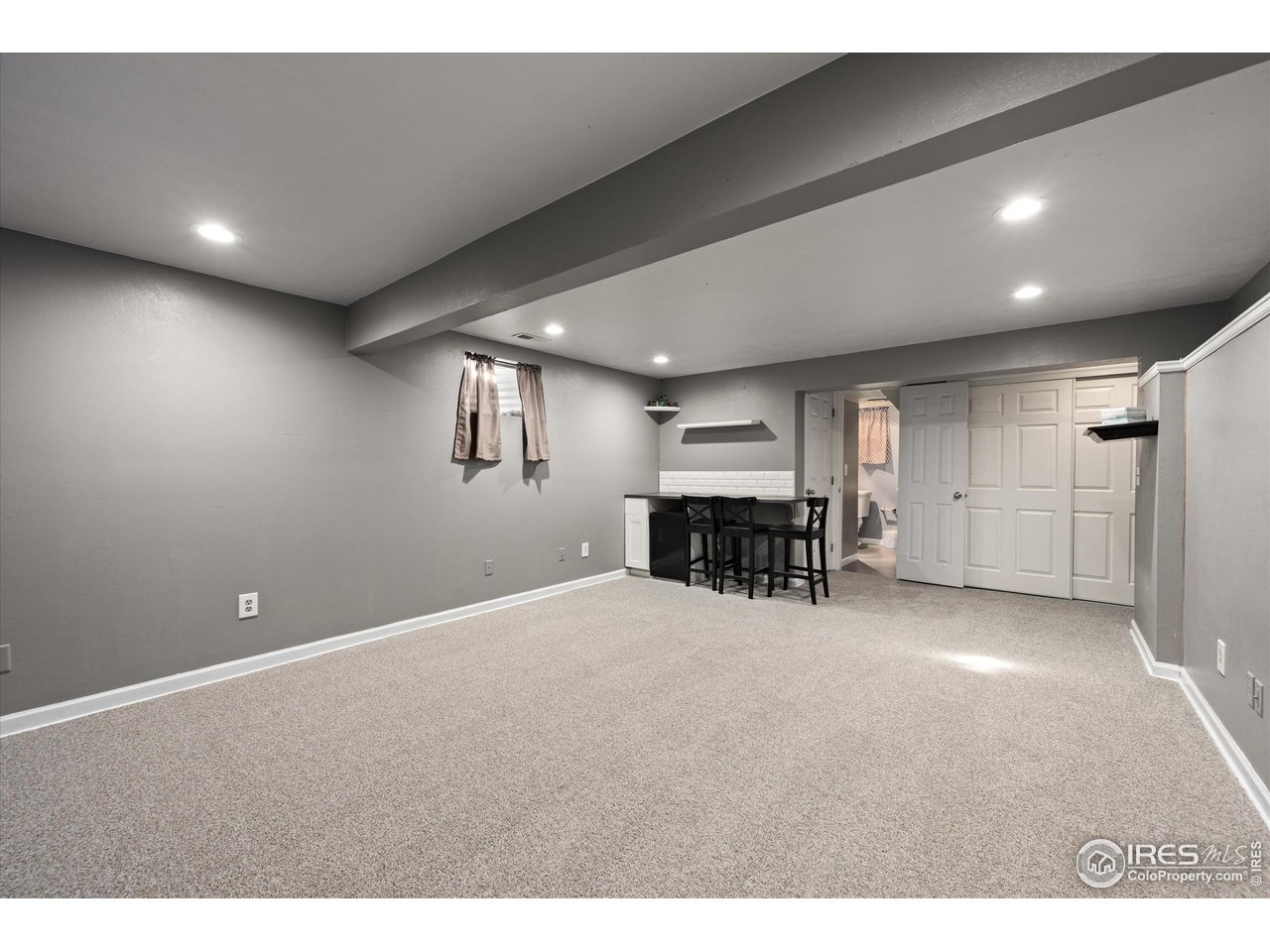 7328 South Gore Range Road Littleton, CO 80127 - Photo 26 of 38 a view of a hall with kitchen and natural light
