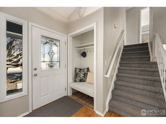 a view of an entryway with wooden floor