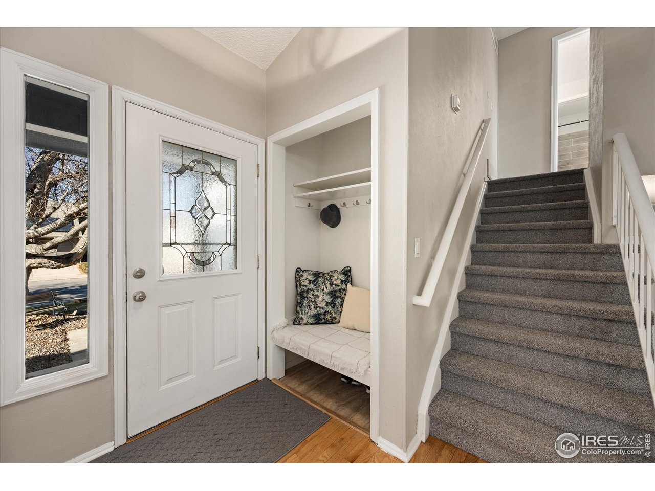 7328 South Gore Range Road Littleton, CO 80127 - Photo 3 of 38 a view of an entryway with wooden floor