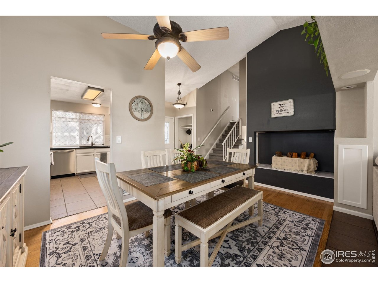 7328 South Gore Range Road Littleton, CO 80127 - Photo 5 of 38 a living room with furniture and a clock