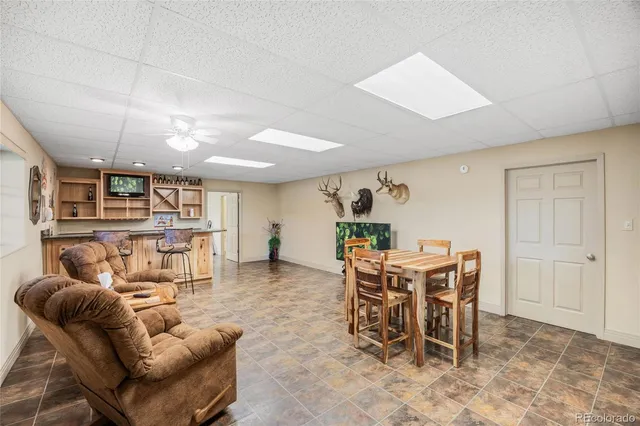 a work room with furniture and a wooden floor