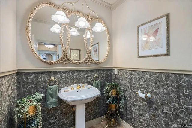a bathroom with a sink mirror and vanity