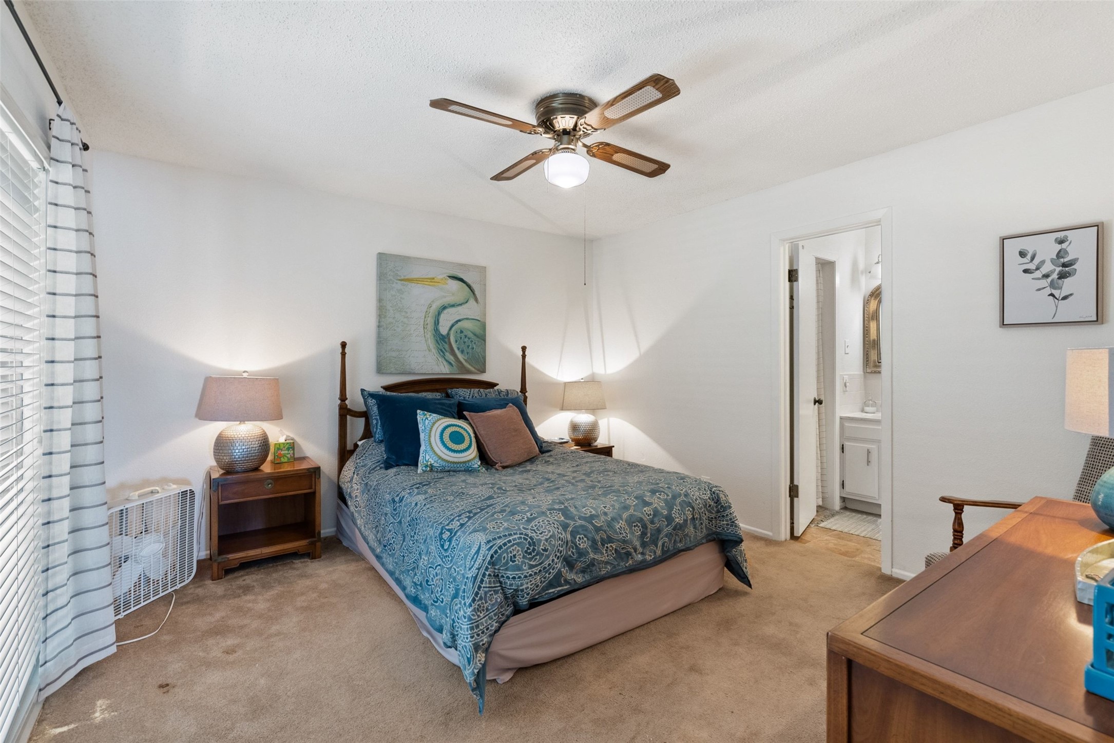 141 Perry Lane Kingsland, TX 78639 - Photo 27 of 40 A quiet retreat, this bedroom offers carpeted flooring and a convenient attached bathroom.