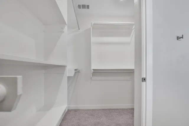 a view of an empty walk in closet
