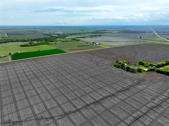 a view of a street with an ocean