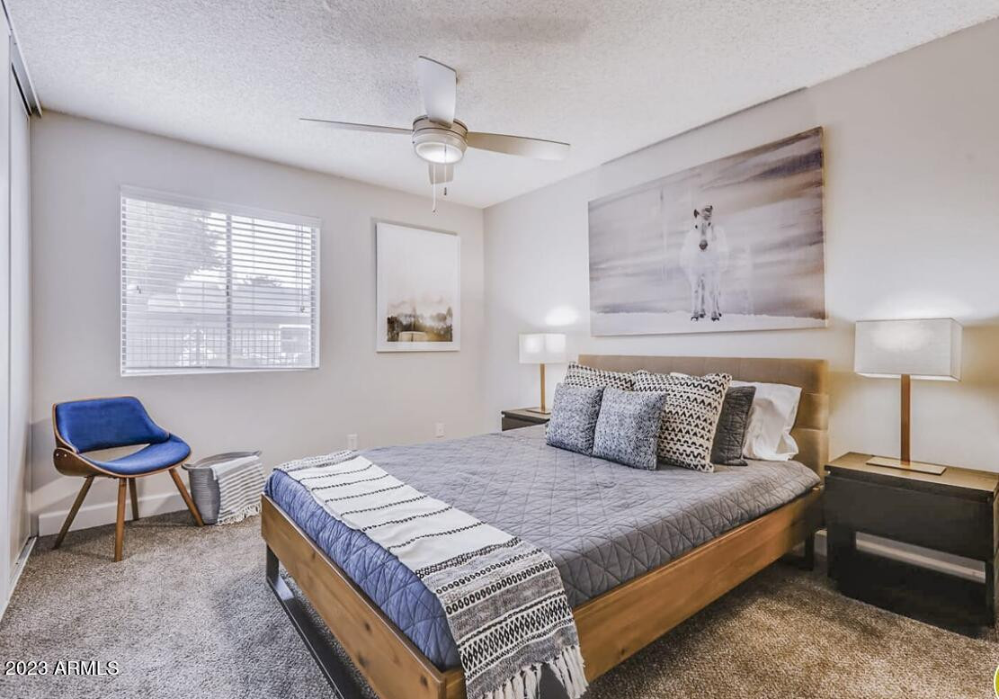 1944 West Thunderbird Road, Unit 2 Phoenix, AZ 85023 - Photo 6 of 14 a bedroom with a bed and chair