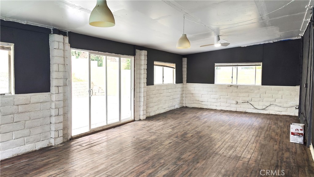 2821 Greenleaf Drive West Covina, CA 91792 - Photo 15 of 32 an empty room with wooden floor and windows