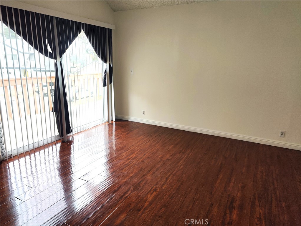 2821 Greenleaf Drive West Covina, CA 91792 - Photo 20 of 32 an empty room with wooden floor and windows