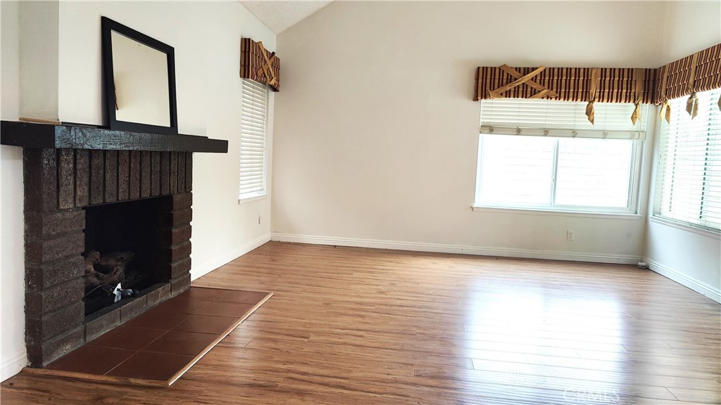 2821 Greenleaf Drive West Covina, CA 91792 - Photo 9 of 32 a view of an empty room with wooden floor and a window
