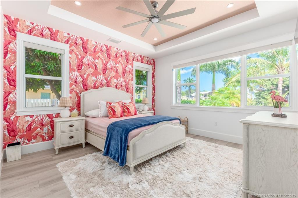 1879 Northwest River Trail Stuart, FL 34994 - Photo 11 of 25 a bedroom with a large bed and a window