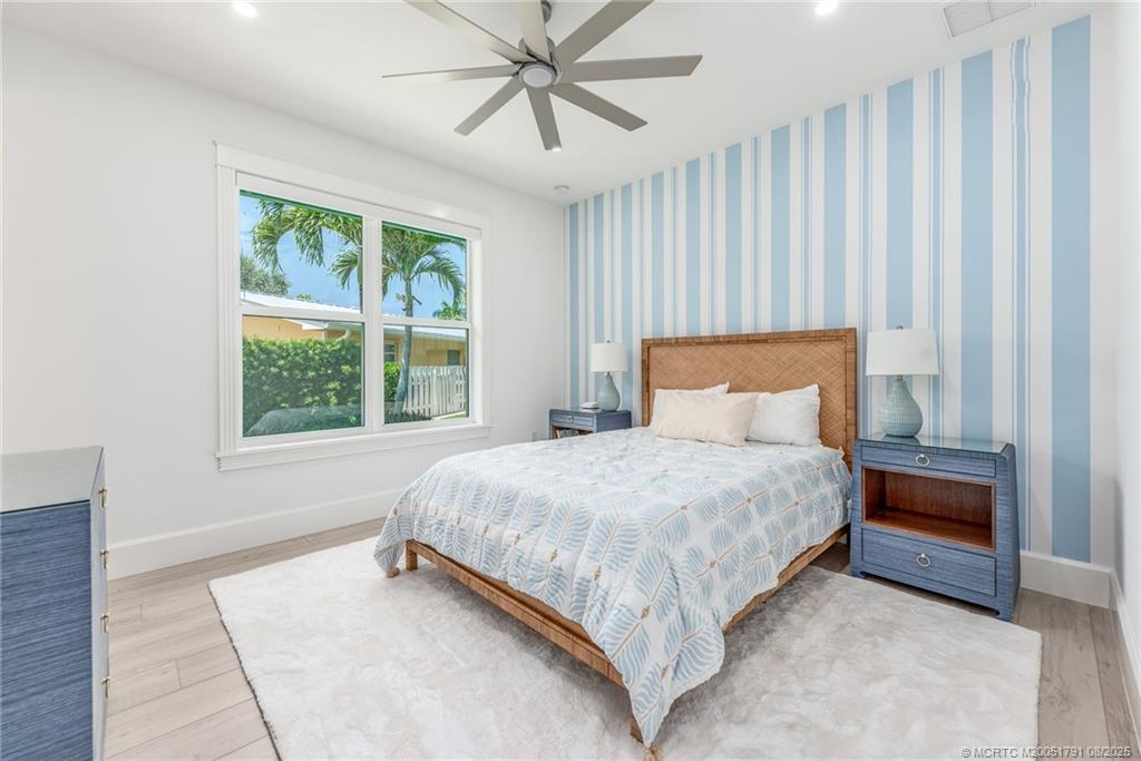 1879 Northwest River Trail Stuart, FL 34994 - Photo 15 of 25 a bedroom with a bed and window