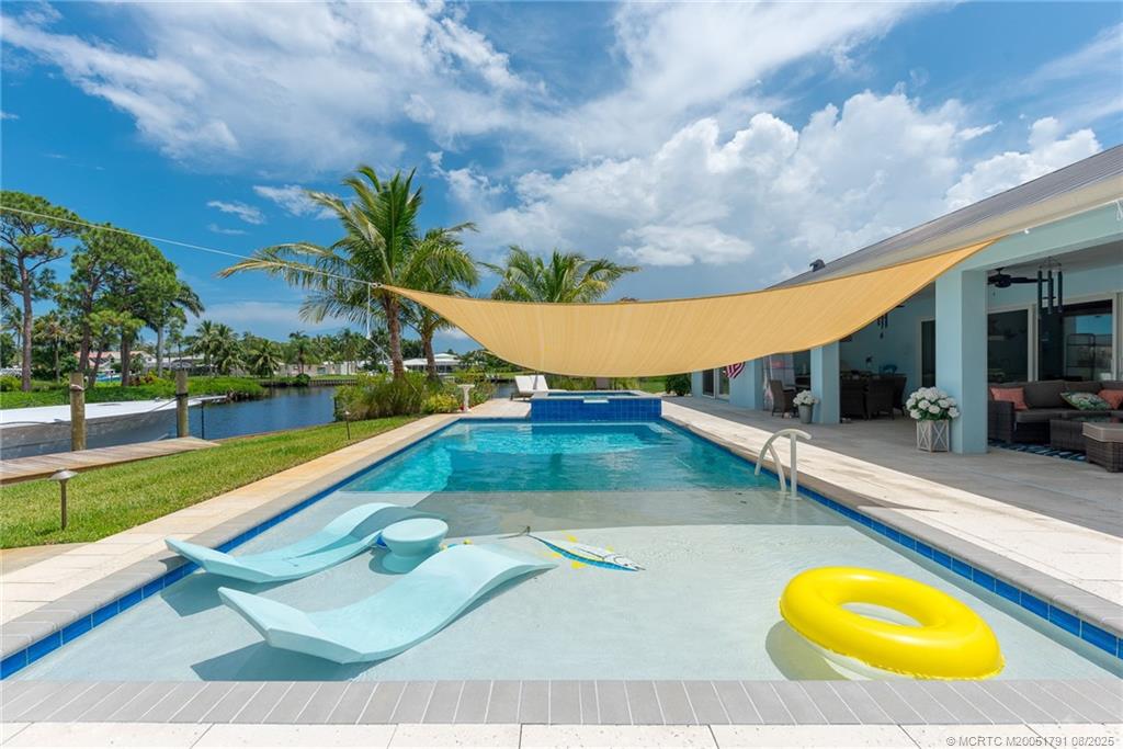 1879 Northwest River Trail Stuart, FL 34994 - Photo 18 of 25 a view of a swimming pool with an outdoor seating