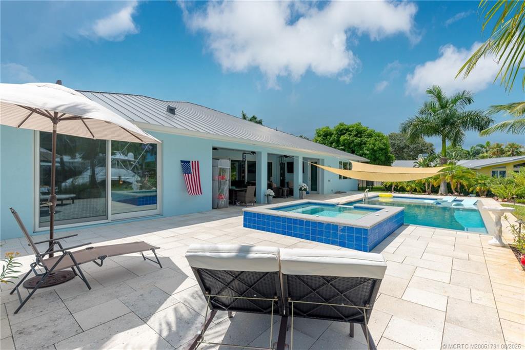 1879 Northwest River Trail Stuart, FL 34994 - Photo 19 of 25 a view of house with backyard outdoor seating and kitchen