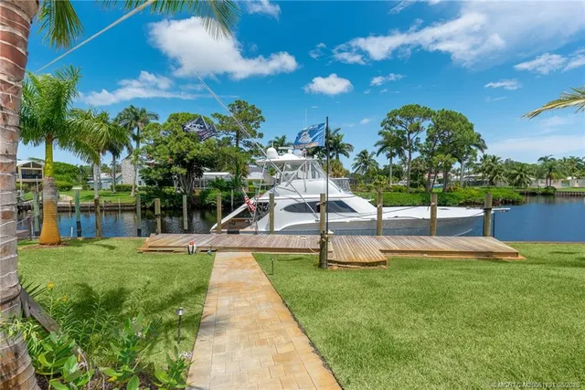 a view of a chairs and table in the garden