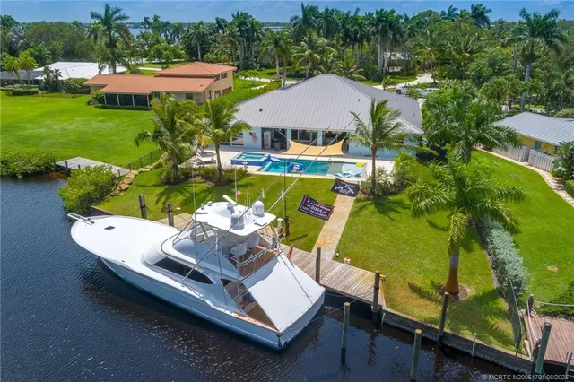 an aerial view of a house with outdoor space