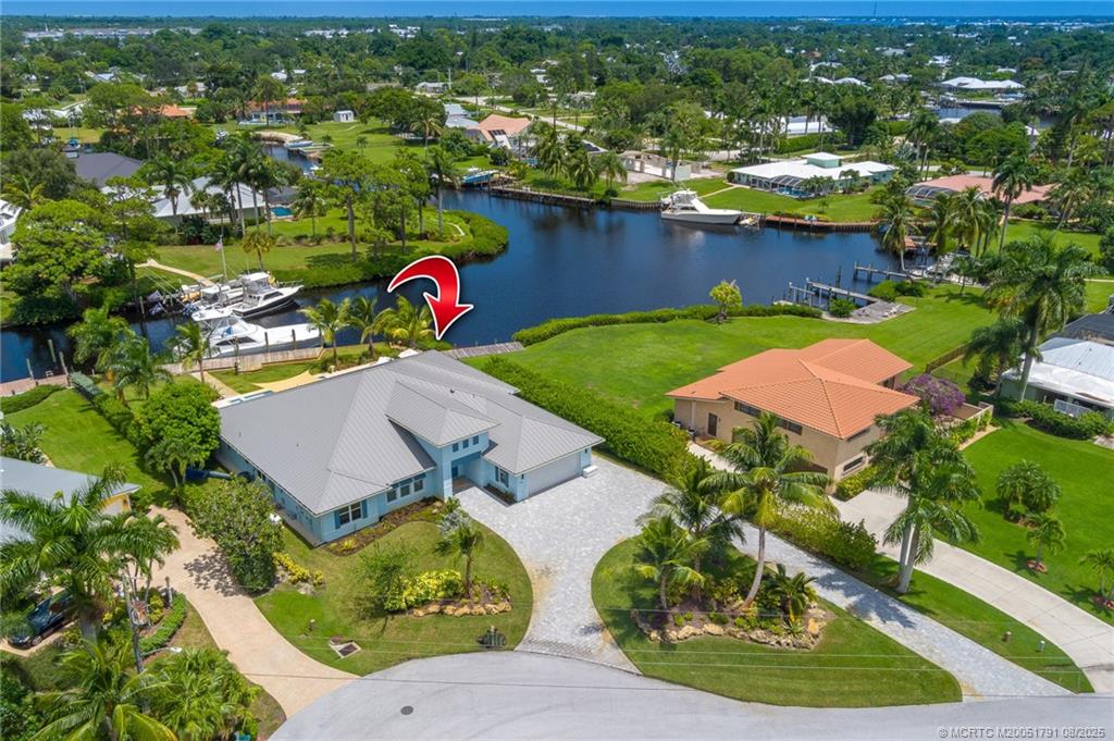 1879 Northwest River Trail Stuart, FL 34994 - Photo 23 of 25 an aerial view of a house with outdoor space and a lake view