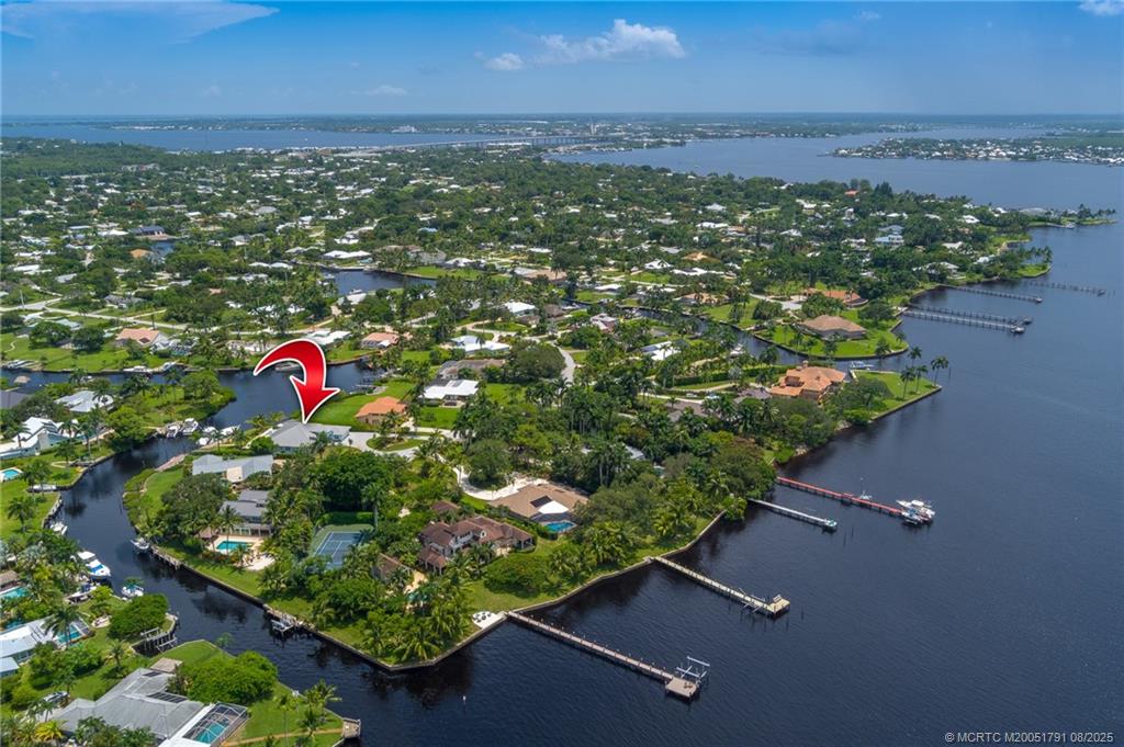 1879 Northwest River Trail Stuart, FL 34994 - Photo 24 of 25 an aerial view of residential house with outdoor space and seating