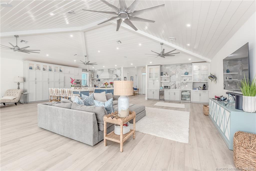 1879 Northwest River Trail Stuart, FL 34994 - Photo 4 of 25 a living room with furniture and a kitchen view