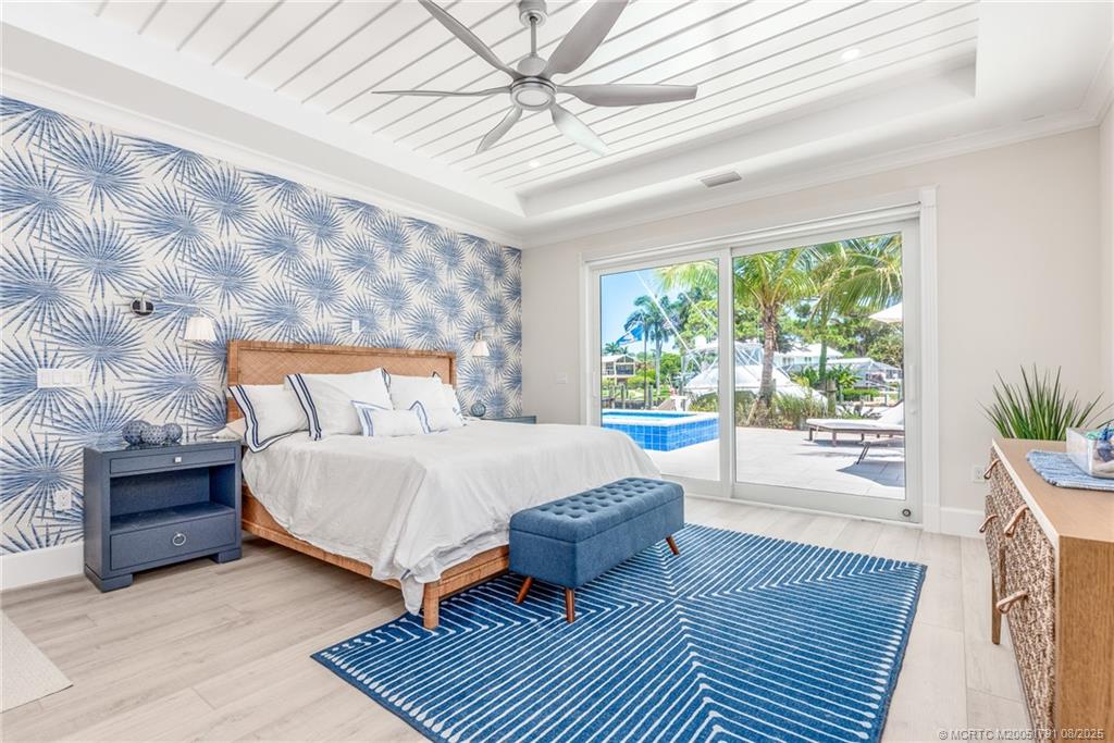 1879 Northwest River Trail Stuart, FL 34994 - Photo 8 of 25 a bedroom with a large bed and a window