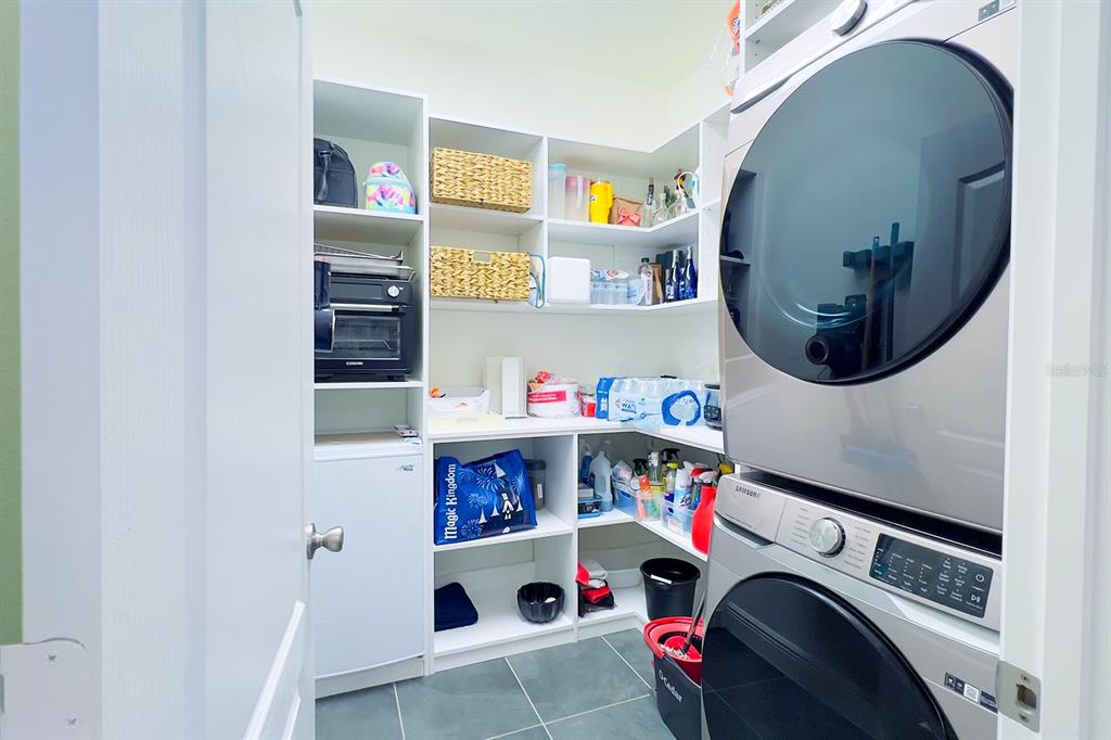 2755 Mdw Strm Way Clermont, FL 34714 - Photo 22 of 64 a utility room with dryer and washer