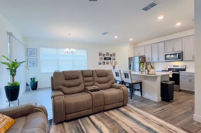 a bedroom with a bed and flat screen tv