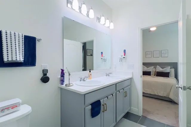a view of hallway with wooden floor and closet