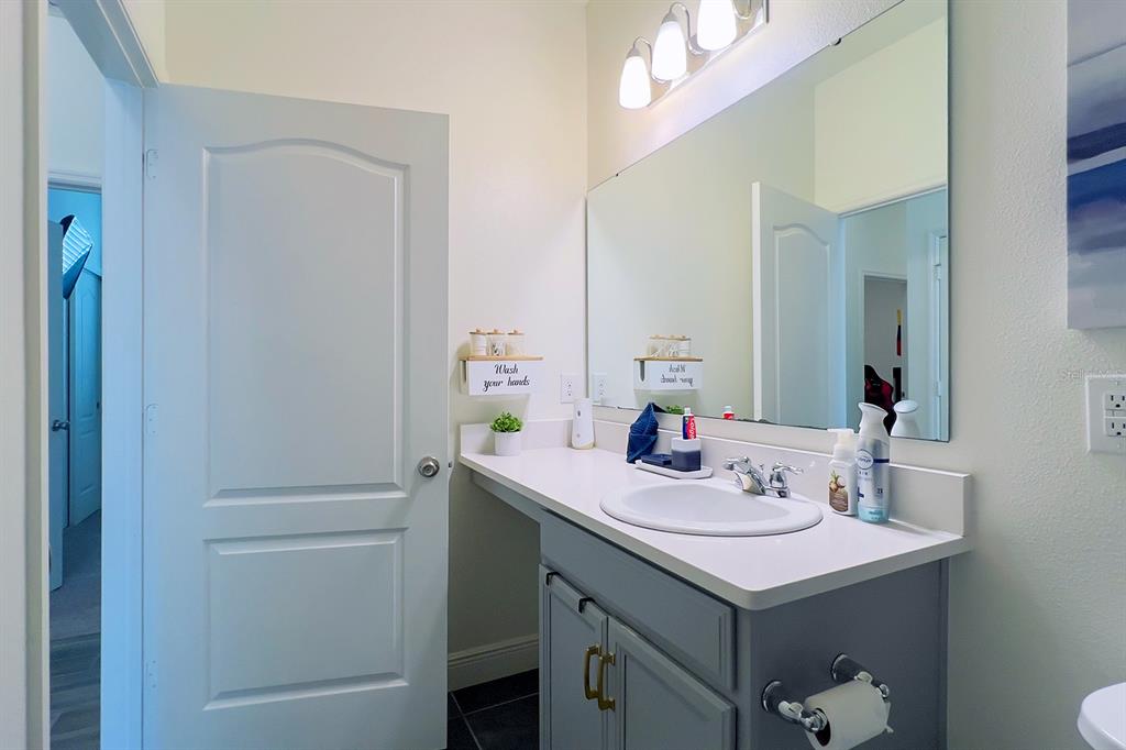 2755 Mdw Strm Way Clermont, FL 34714 - Photo 42 of 64 a bathroom with a sink and a mirror