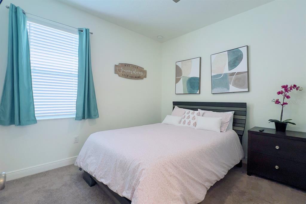 2755 Mdw Strm Way Clermont, FL 34714 - Photo 43 of 64 a bedroom with a bed and a window