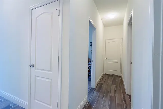 a bathroom with a sink mirror and toilet