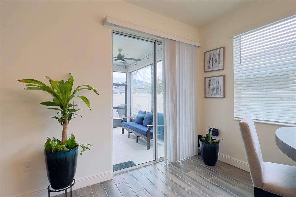 2755 Mdw Strm Way Clermont, FL 34714 - Photo 56 of 64 a view of a dining room with furniture window and wooden floor