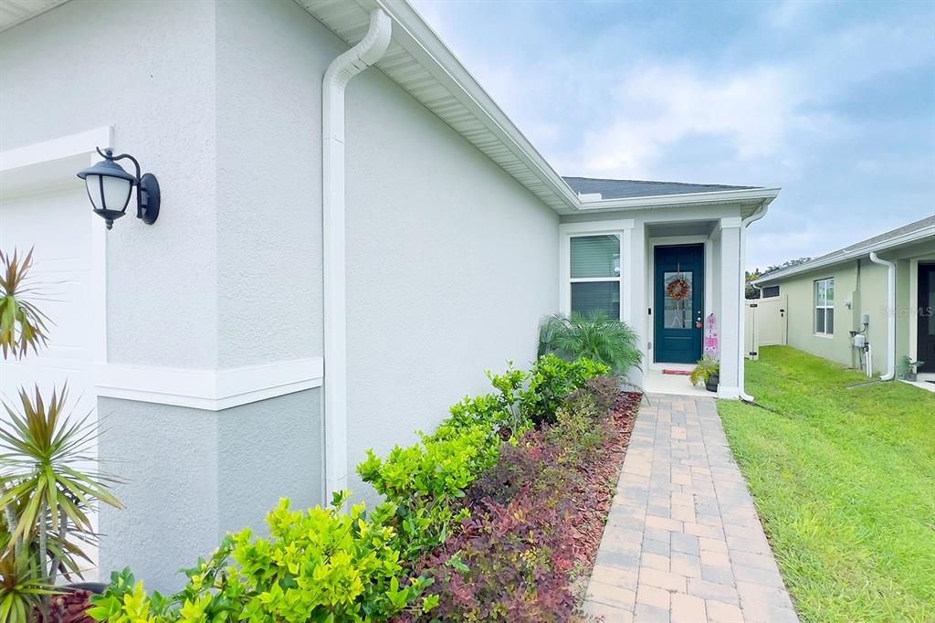 2755 Mdw Strm Way Clermont, FL 34714 - Photo 6 of 64 a front view of a house with a yard