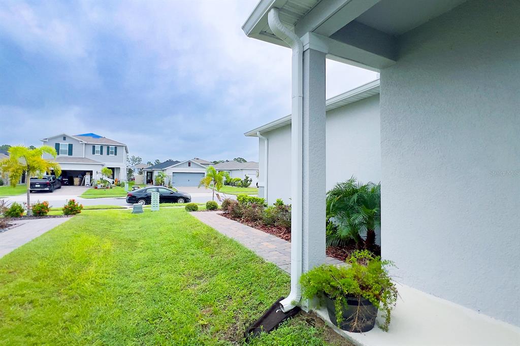 2755 Mdw Strm Way Clermont, FL 34714 - Photo 8 of 64 a view of back yard of the house