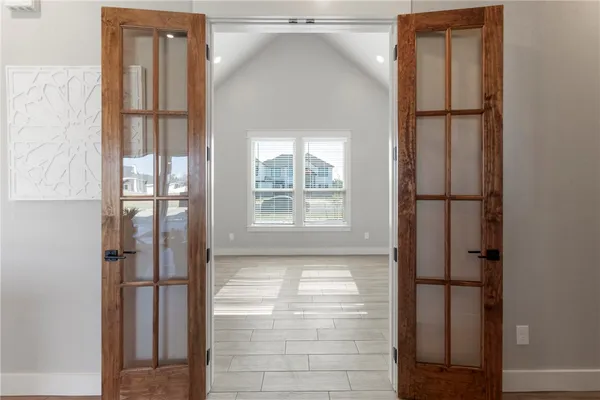 a view of a room with a ceiling fan