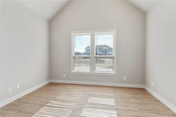 a view of a room with a ceiling fan