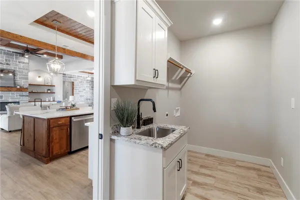 a view of a room with a ceiling fan and a window