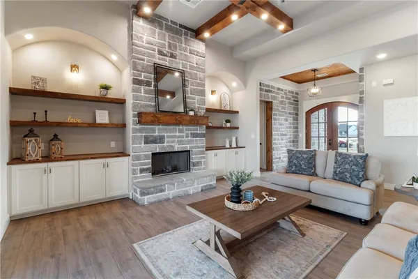 a living room with furniture and a fireplace