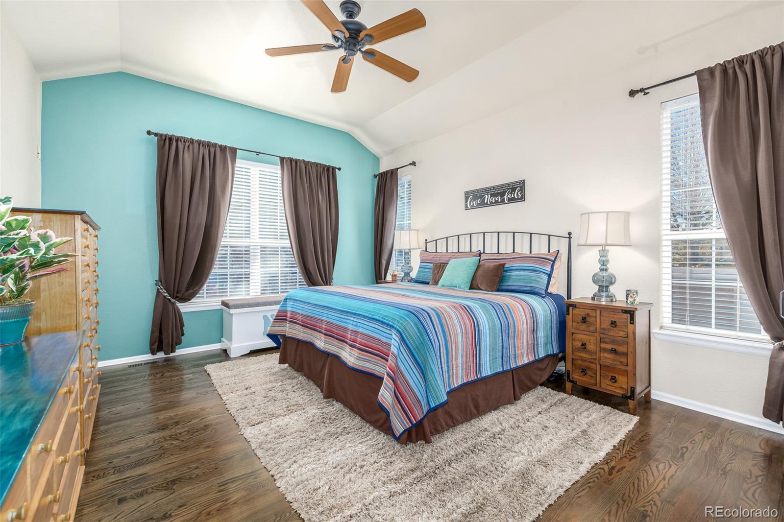 14704 Eagle River Loop Broomfield, CO 80023 - Photo 13 of 30 a bedroom with a bed lamps and window