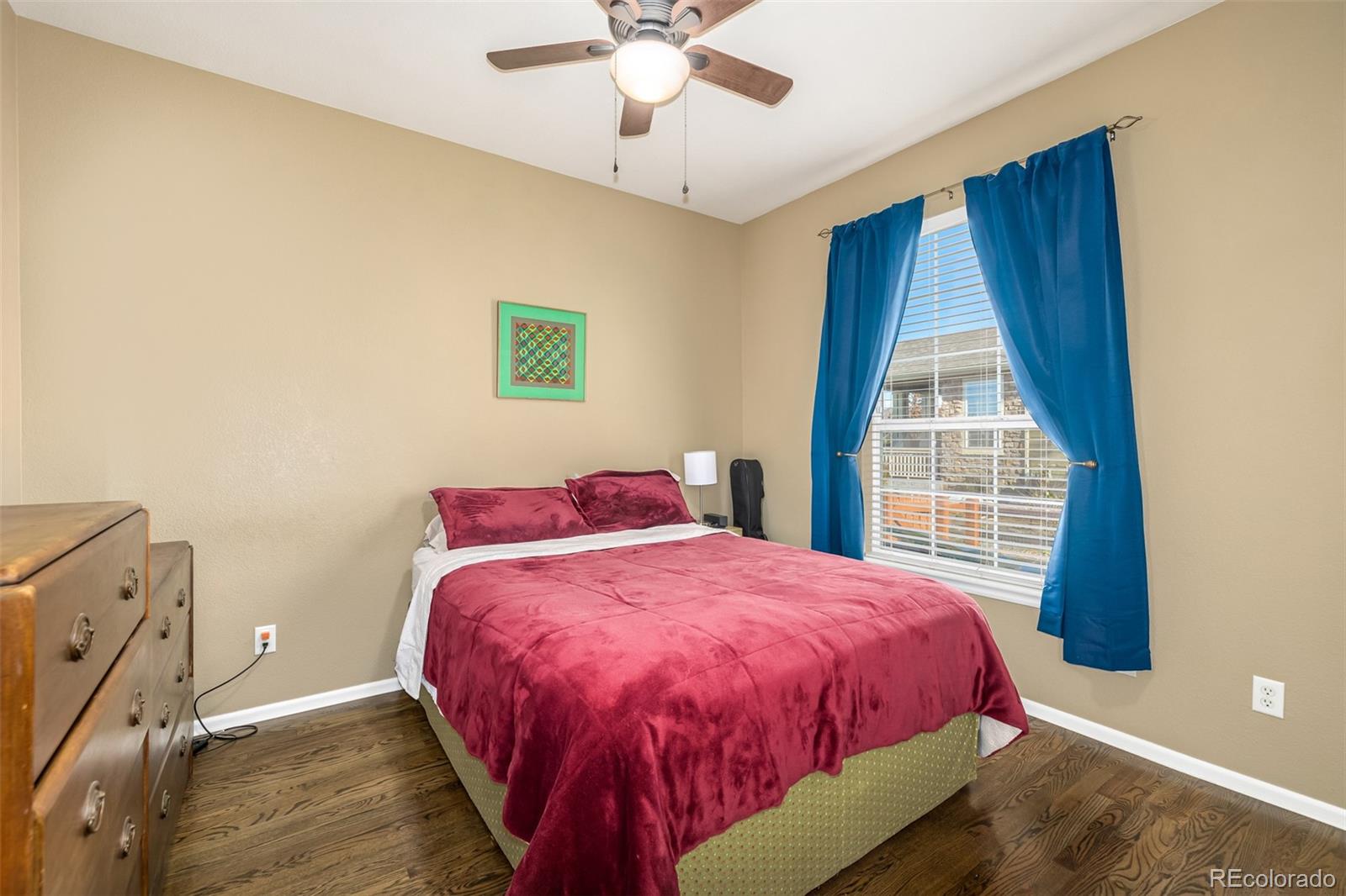 14704 Eagle River Loop Broomfield, CO 80023 - Photo 16 of 30 a bed sitting in a bedroom next to a window