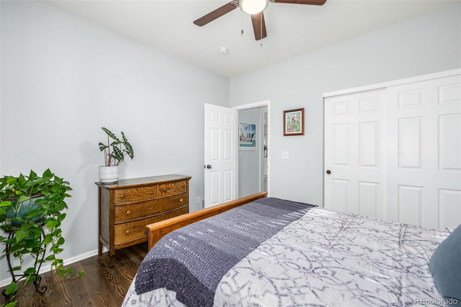 14704 Eagle River Loop Broomfield, CO 80023 - Photo 17 of 30 a bedroom with a bed and a potted plant