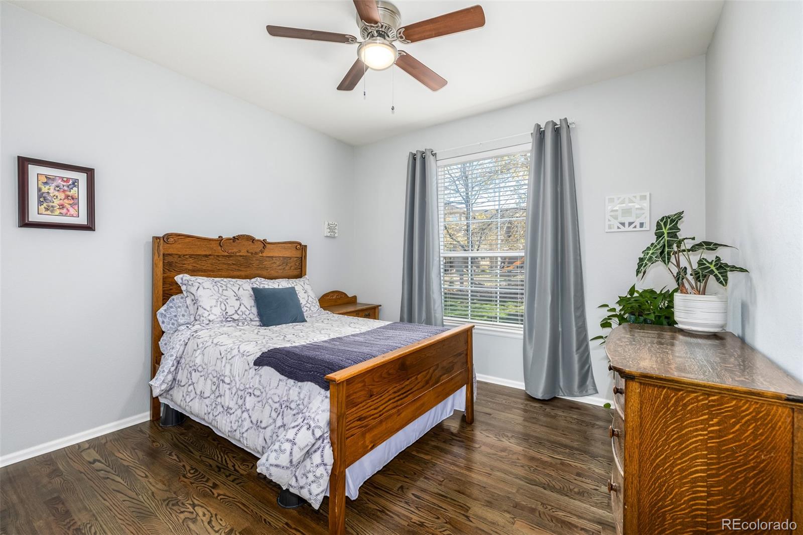 14704 Eagle River Loop Broomfield, CO 80023 - Photo 18 of 30 a bedroom with a bed and window