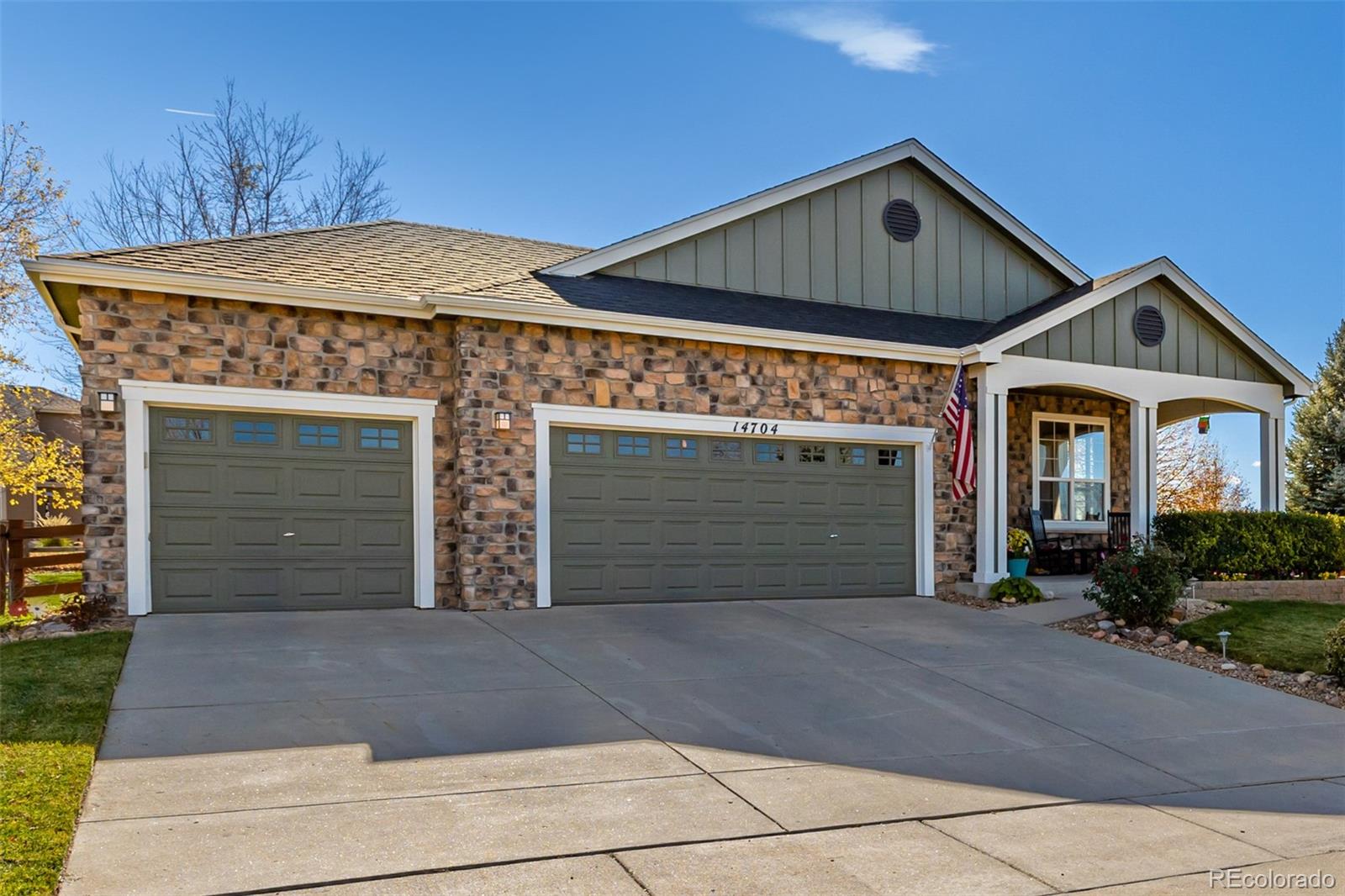 14704 Eagle River Loop Broomfield, CO 80023 - Photo 2 of 30 a front view of a house with garage