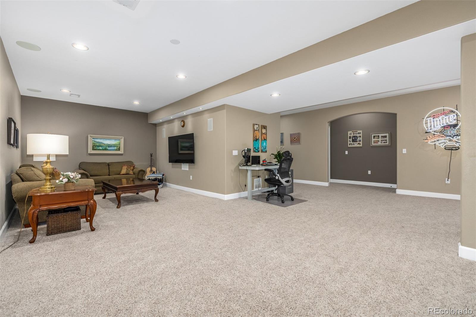 14704 Eagle River Loop Broomfield, CO 80023 - Photo 21 of 30 a living room with furniture and a flat screen tv