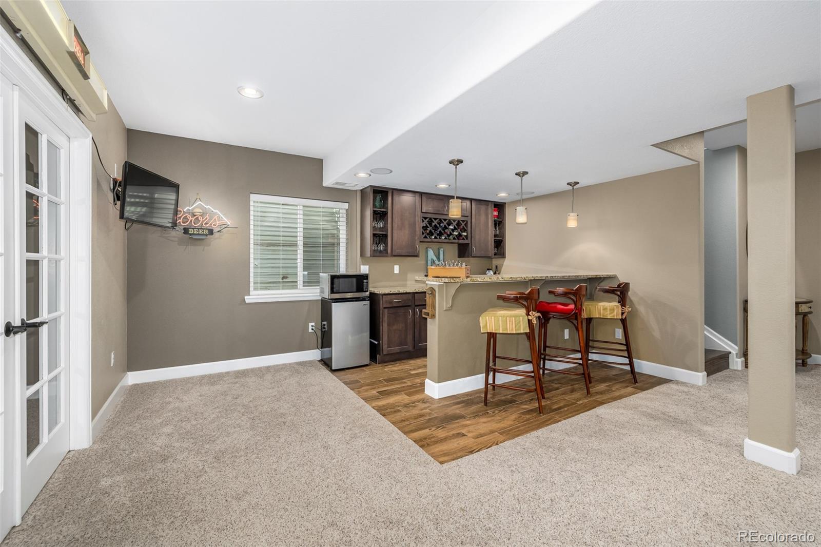 14704 Eagle River Loop Broomfield, CO 80023 - Photo 22 of 30 a open kitchen with stainless steel appliances granite countertop a refrigerator and a stove top oven