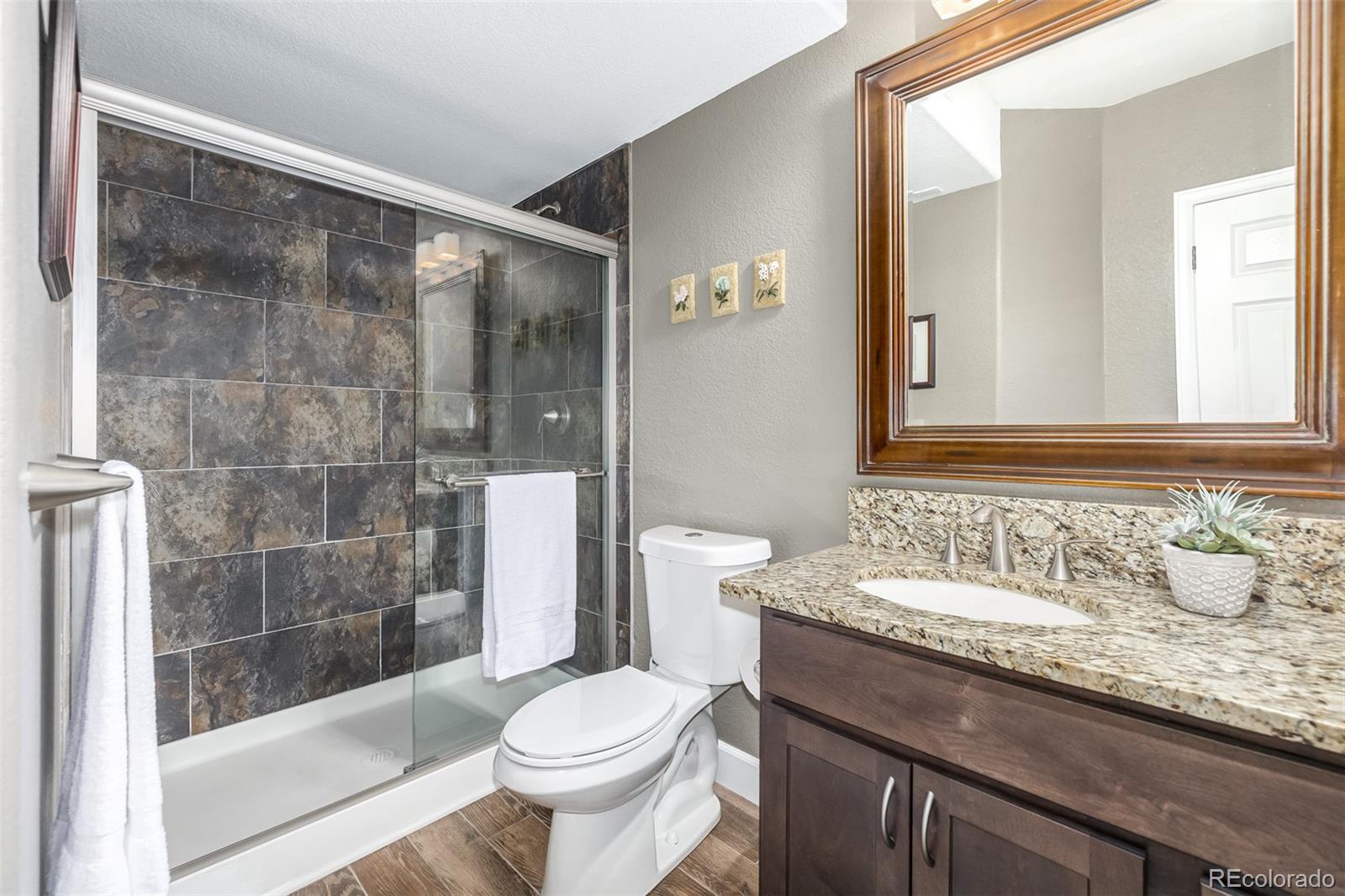 14704 Eagle River Loop Broomfield, CO 80023 - Photo 26 of 30 a bathroom with a sink and a mirror