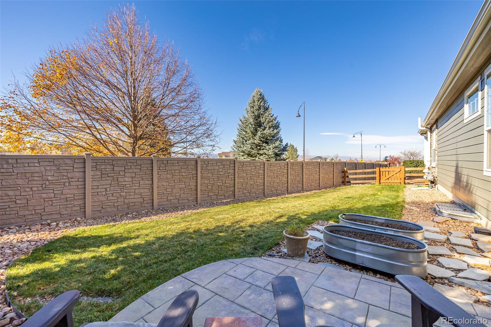 14704 Eagle River Loop Broomfield, CO 80023 - Photo 30 of 30 a view of a backyard with wooden fence