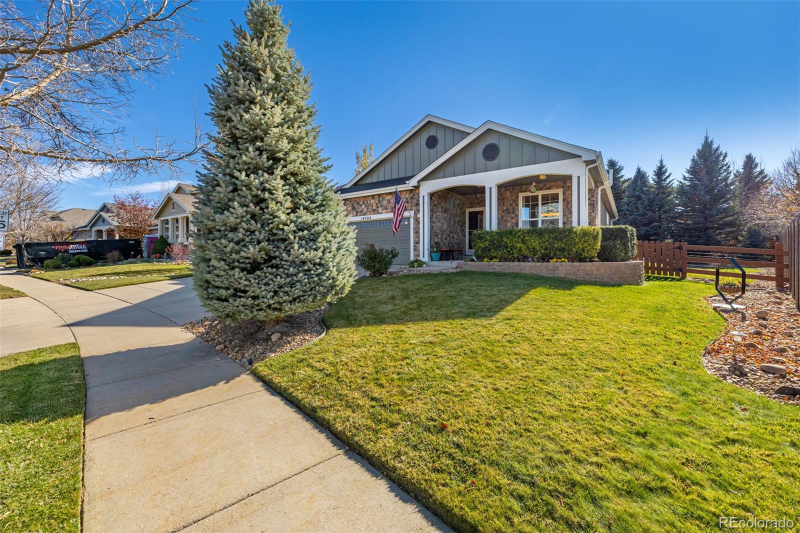 14704 Eagle River Loop Broomfield, CO 80023 - Photo 3 of 30 a front view of house with yard and green space